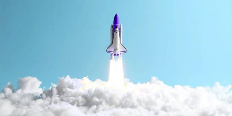 A picture of a rocket ship taking off into sky.